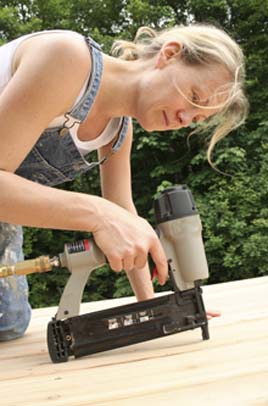 Using a power nailer to install a new pool deck