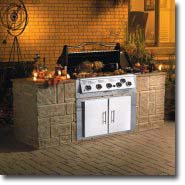 A nice Vermont Casting BBQ installed on a brick patio